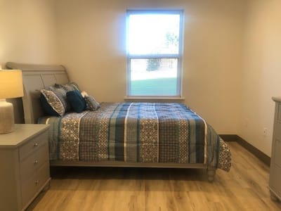 A cozy bedroom with a bed and furniture