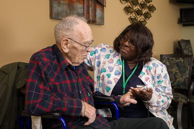 Staff member interacting with a resident in a common area