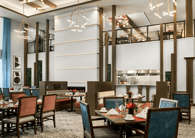 Dining room area with elegantly set tables