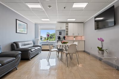 Bright interior common area with seating and kitchenette