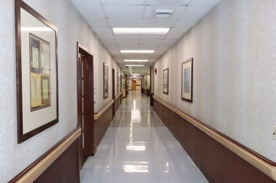 Corridor in a nursing home facility with framed artwork