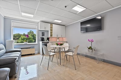 Bright interior of a common area with a dining table
