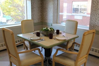Dining table set with plates and a centerpiece