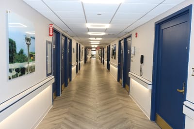 A well-lit hallway in a senior care facility