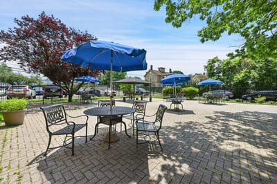 Outdoor seating area with umbrellas in a garden