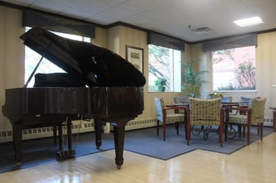 Interior lounge area with a piano and seating