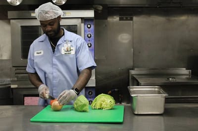 Staff member preparing food in the kitchen