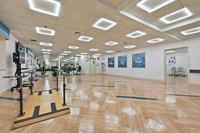 Open rehabilitation area with exercise equipment