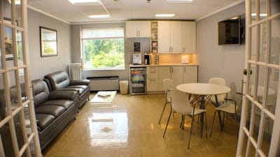 Interior view of a cozy common area with seating