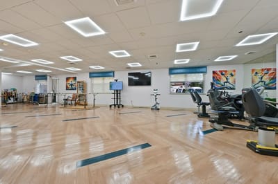 Interior view of a rehabilitation gym with exercise equipment