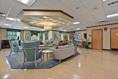 Bright common area with comfortable seating and greenery