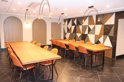 Modern common area with large tables and stylish decor