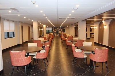 Bright interior dining area with tables and chairs