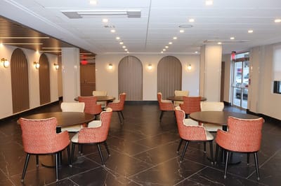 Bright common area with tables and chairs