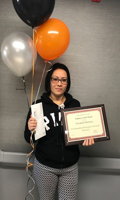 Staff member celebrating Employee of the Month award