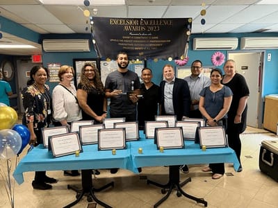 Staff and residents celebrating at an awards ceremony