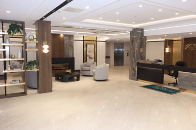 Modern lobby area with seating and a reception desk
