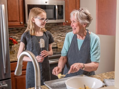 Residents baking cookies in a kitchen