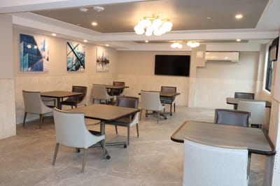Bright interior common area with tables and chairs
