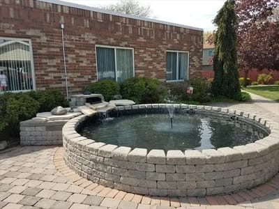 Outdoor water fountain in a landscaped area