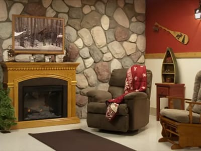Cozy lounge area with stone walls and comfortable seating