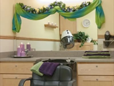 Beauty salon area with hair dryer and decor