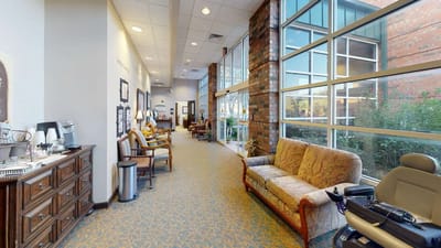 Bright interior corridor with seating and windows