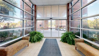 Main entrance area with seating and greenery