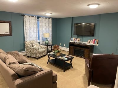 Comfortable common area with seating and a TV