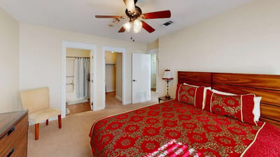 Cozy bedroom with decorative bedding in a senior living facility