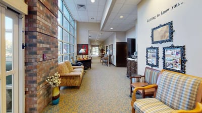 Interior hallway with seating and decorative wall