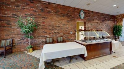 Dining area with a serving station and chairs