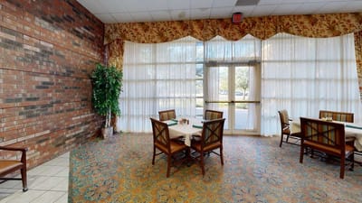 Dining area with tables and large windows