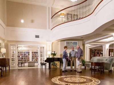 Residents chatting in a bright common area
