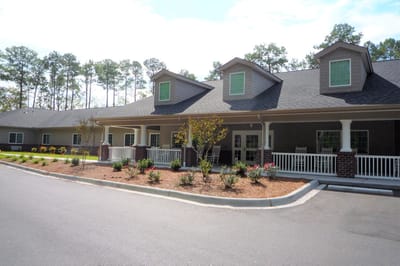 Exterior view of New Hanover House with garden landscaping