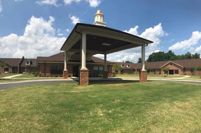 Exterior view of the facility entrance with landscaping