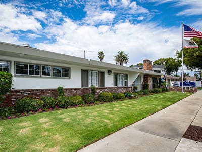 Exterior view of Pomona Vista Care Center with landscaping