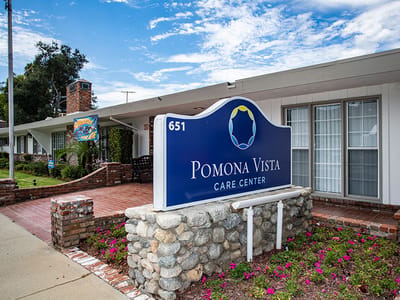 Facade with facility name display at Pomona Vista Care Center