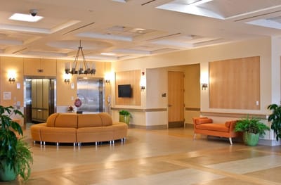 Bright interior common area with seating and plants