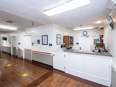 Interior hallway with reception area in a care facility