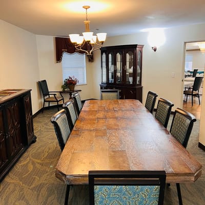 Dining room with a large wooden table and chairs
