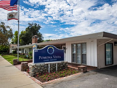 Exterior view of Pomona Vista Care Center with signage