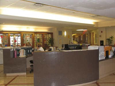 Reception area with staff attending to paperwork