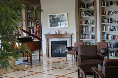 Cozy library area with bookshelves and seating