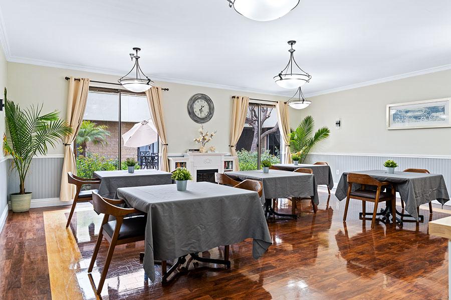 Bright dining room with tables and plants