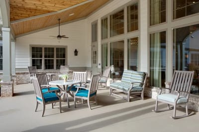 Outdoor seating area with tables and chairs