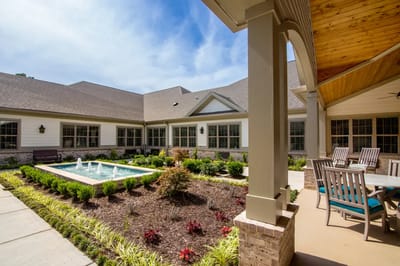 A serene outdoor space with landscaping and fountain