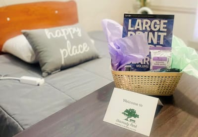 Cozy resident room setup with welcoming basket
