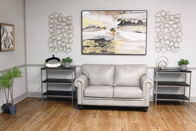 Cozy common area with a sofa and decorative art