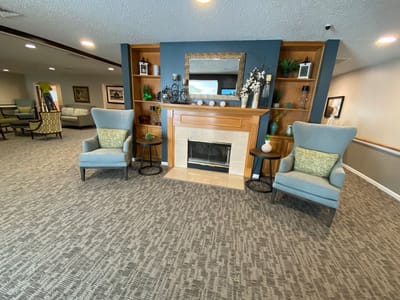 Interior view of a cozy common area with seating